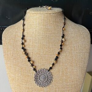 NWT Handcrafted Black & Tan Beaded Necklace with Silver Medallion.Rope necklace